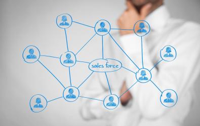Man drawing a flowchart diagram centered around Salesforce.
