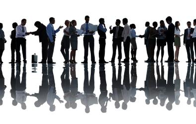 Silohuettes of working people in a line.