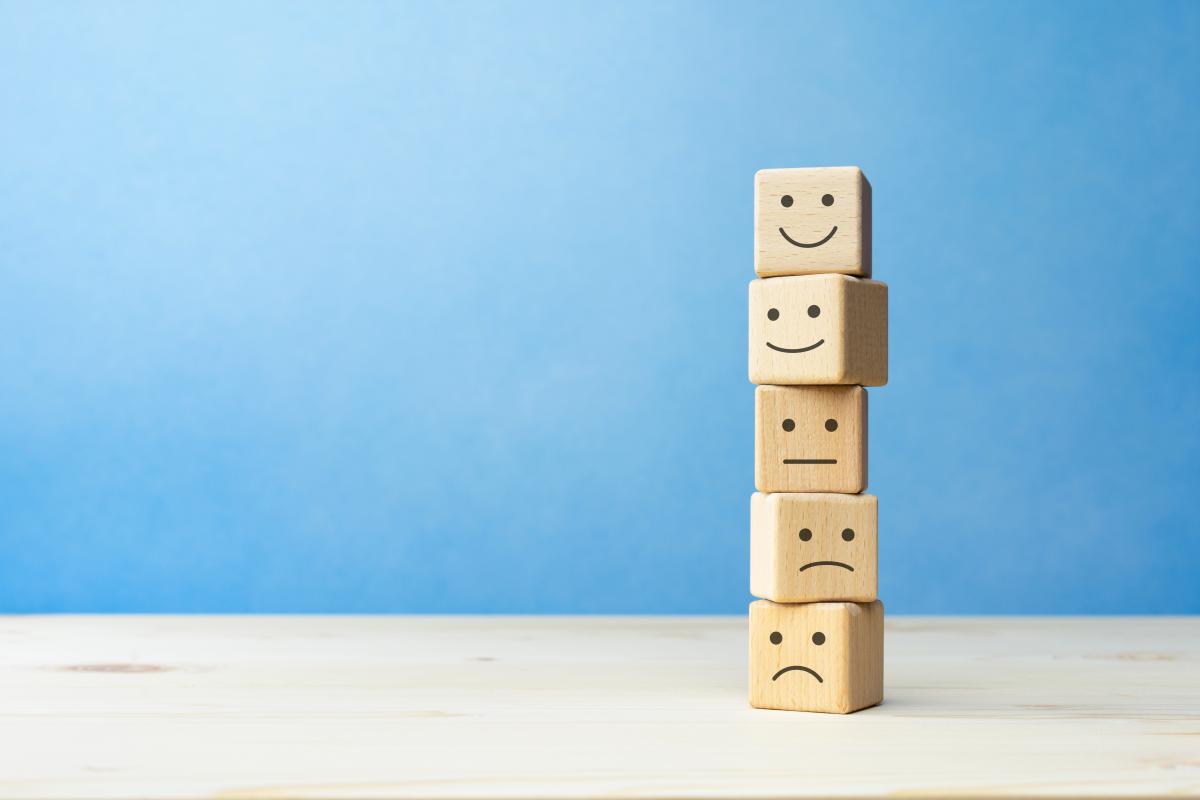 Wooden blogs stacked with facial expressions